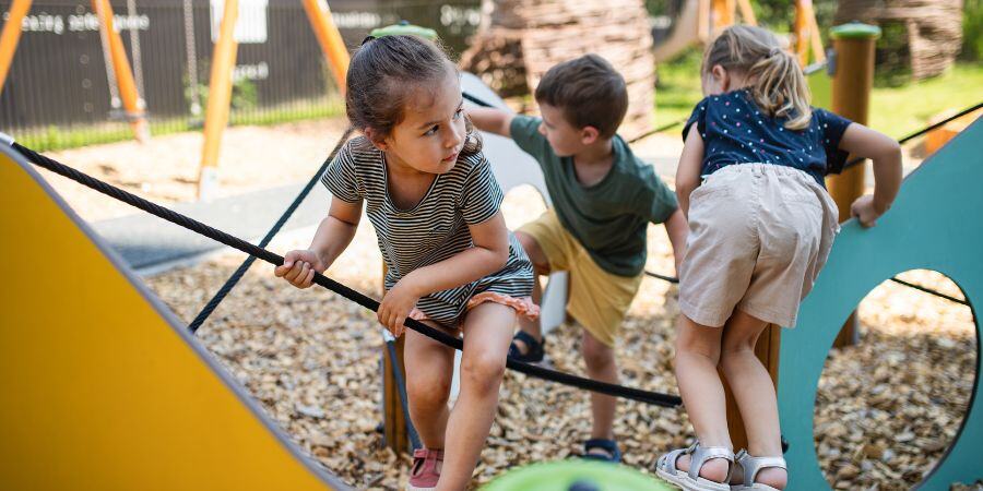 group of small nursery school children playing outside